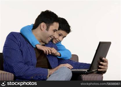 Father and son with a laptop