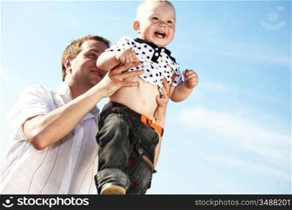 father and take son in blue sky