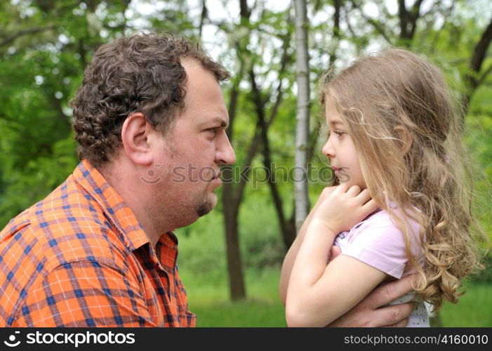 father attempting to discipline his daughter