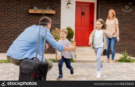 Father came home from the trip and happy son, daughter and wife running to meet him