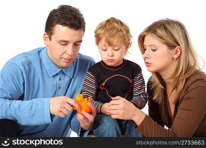 Father cleans to son an orange