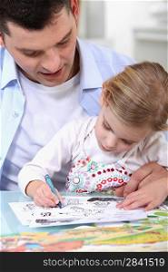 Father drawing with daughter