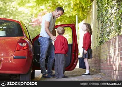 Father Driving To School With Children