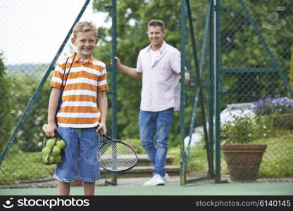 Father Dropping Son Off For Tennis Lesson