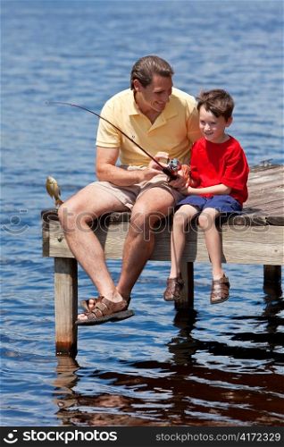 Father Fishing With His Son On A Jetty