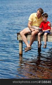 Father Fishing With His Son On A Pier