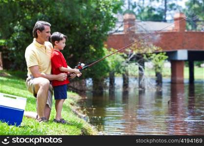 Father Fishing With His Son On A RIver