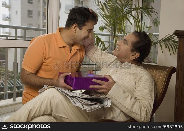 Father giving his father a gift