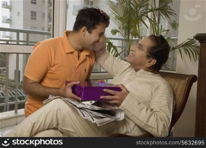 Father giving his father a gift