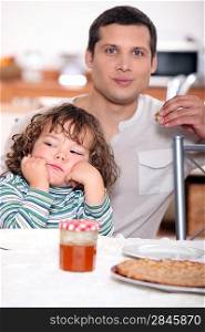 Father having crepes with his child