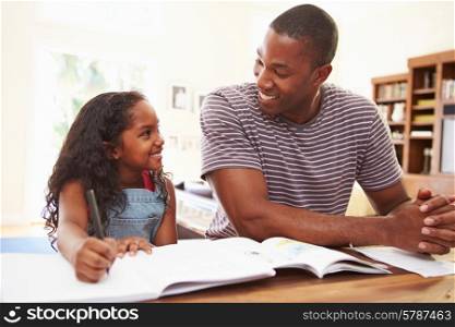 Father Helping Daughter With Homework