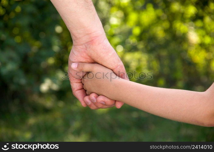 father holding  daughter hand