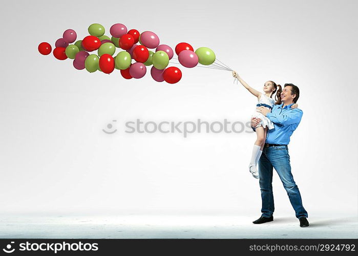 Father holding on hands daughter