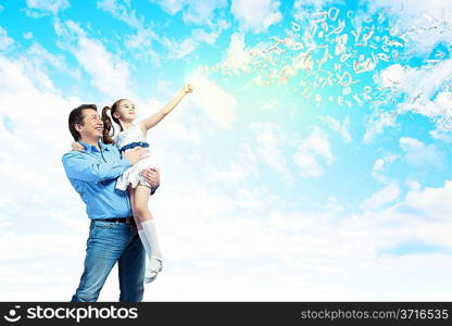 Father holding on hands daughter