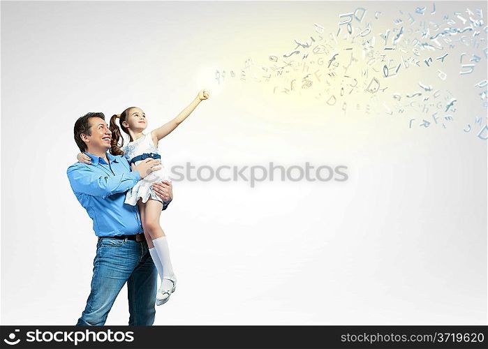 Father holding on hands daughter