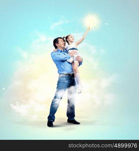 Father holding on hands daughter. Image of happy father holding on hands daughter