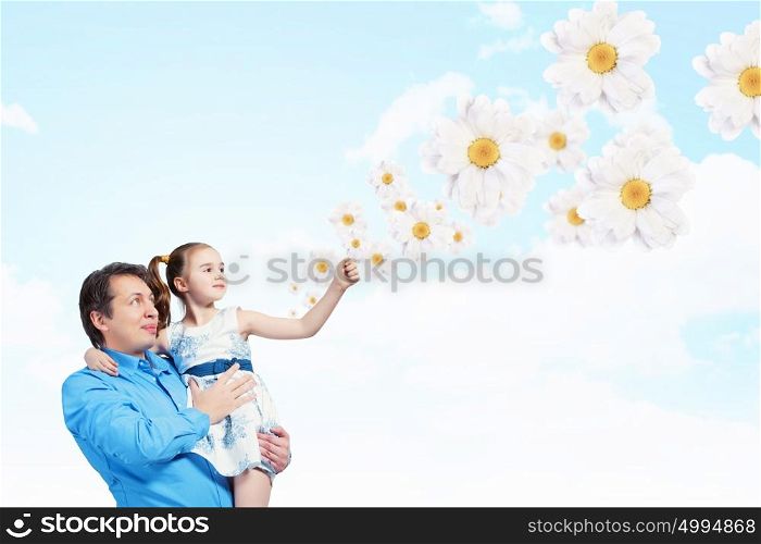 Father holding on hands daughter. Image of happy father holding on hands daughter