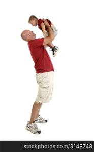 Father holding son up into air over white background.