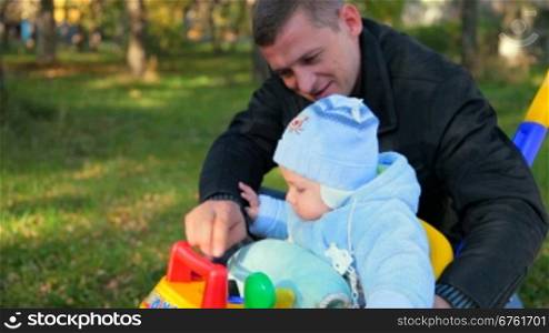 father playing with his baby
