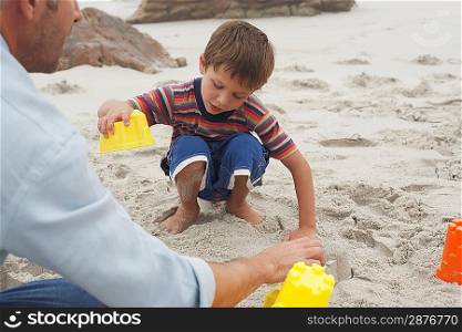 Father Playing with Son on Beach