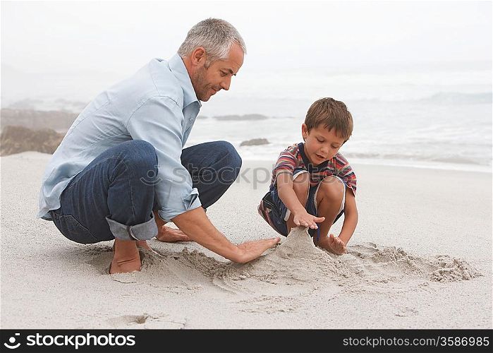Father Playing with Son on Beach