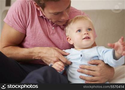 Father Playing With Young Son Indoors