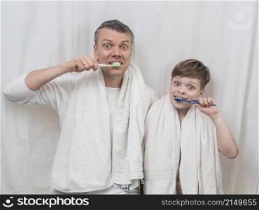 father s day brushing teeth together