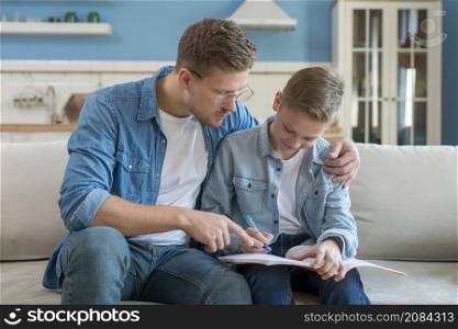 father son doing homework