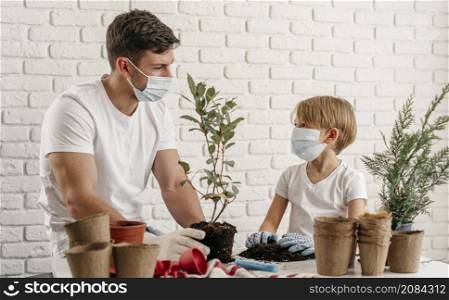 father son learning about gardening together home