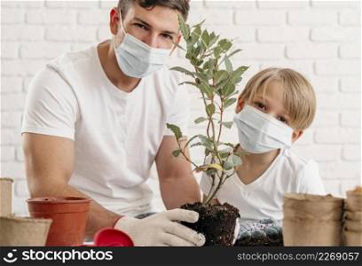 father son learning about planting together home