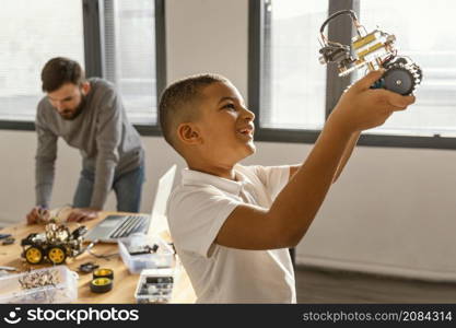 father son making robot