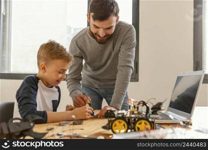 father son making robot 3