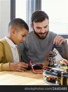 father son making robot 5