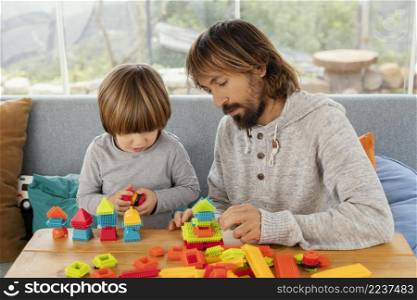 father son playing together