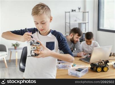 father sons making robot