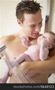 Father Taking Shower With Baby Daughter