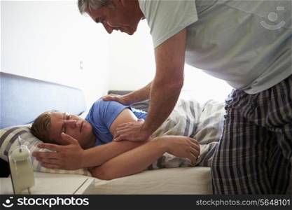 Father Waking Up Teenage Son