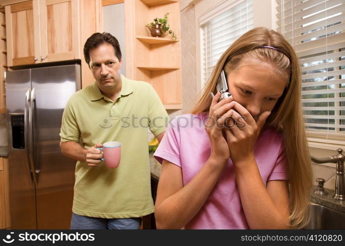 Father watching Daughter on phone