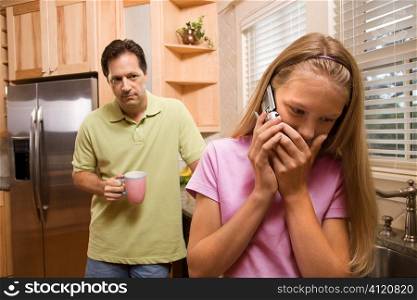 Father watching Daughter on phone