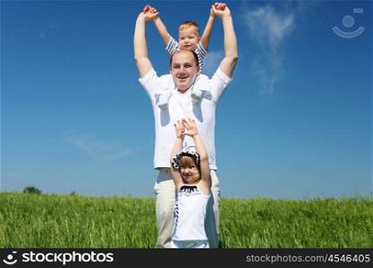 father with his child outdoor against blue sky
