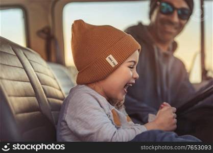 Father with his Little Baby Boy in the Car. Enjoying Road Trip Adventures. Active People. Laughing and with Pleasure Spending Time Together. Happy Family Life.