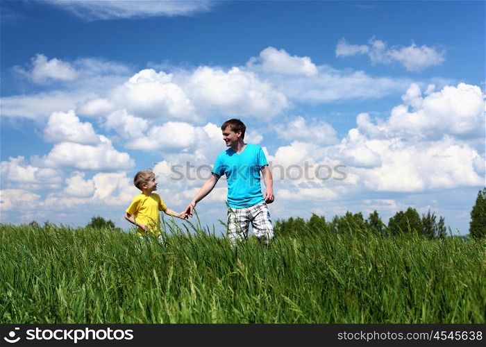 father with little son in summer day outdoors