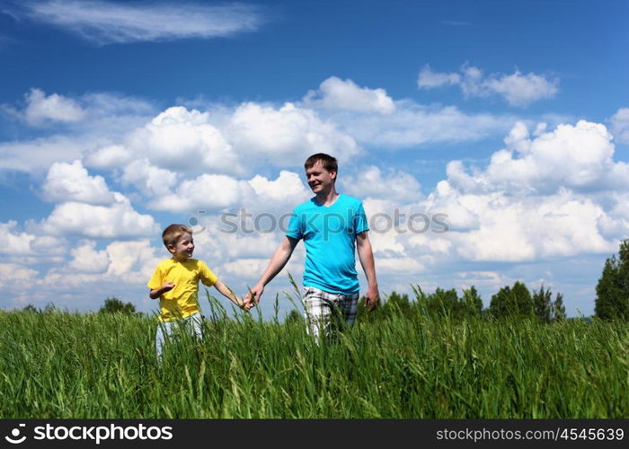 father with little son in summer day outdoors