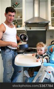 father with the son on the kitchen