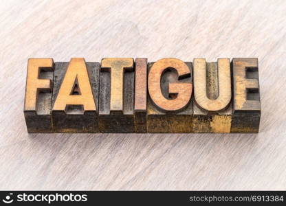 fatigue word abstract in vintage letterpress wood type printing blocks