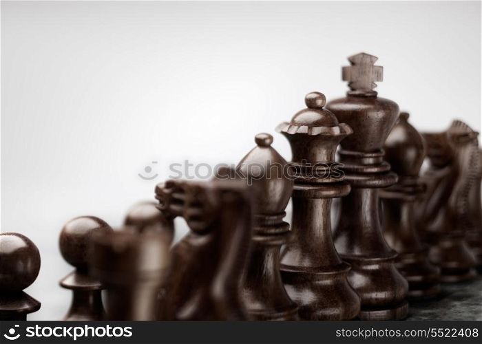 Fearless chess set standing in a row before battle ready to fight as a team.