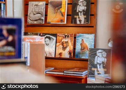 FEB 12, Chiang Mai, THAILAND - Various book collections on wooden shelf with out focus foreground in small bookstore