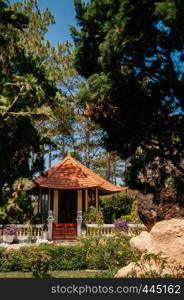 FEB 26, 2014 Dalat, Vietnam - Chinese Pavilion at Truc Lam Da Lat Zen Monastery - Vietnamese buddhist temple with Asian style garden and big tree