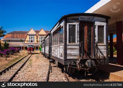 FEB 26, 2014 Dalat, Vietnam - Old Dalat railway station - Vietnam. Station was opened in 1938. Vintage wooden train car at platform.