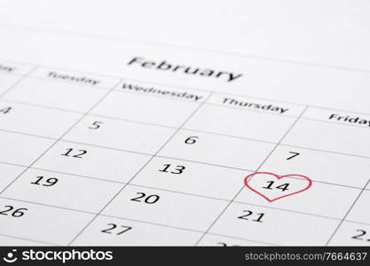 February 14 on the calendar, Valentine’s day, red heart on date. February 14 on calendar Valentines day